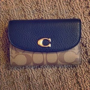 Mini tri-fold coach wallet
